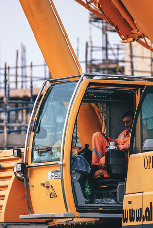 Excavator operator at work